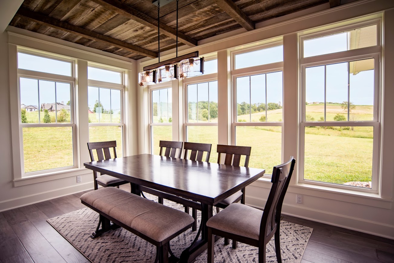 a series of double hung windows in a dining room