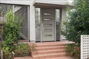 Modern Legacy Steel front door with rectangular glass inserts and sidelights.