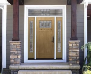 an entry door system with a window in the door and surrounding sidelites
