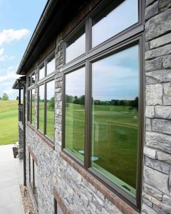 modern windows on exterior of home with brick siding