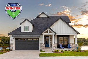 Modern home in Shreveport, LA featuring energy-efficient windows, a custom entry door, architectural shingles, and metal roofing accents installed by WinTek USA